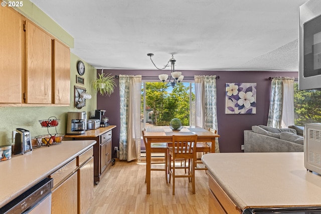 1997 Hazel St, Myrtle Point, OR 97458 - kitchen featuring dishwasher, light wood-type flooring, light countertops, and plenty of natural light