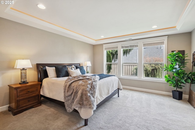 carpeted bedroom featuring a tray ceiling, baseboards, and recessed lighting
