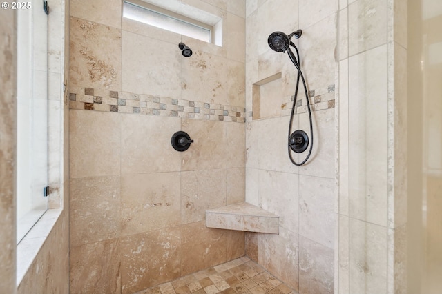 full bath with tiled shower