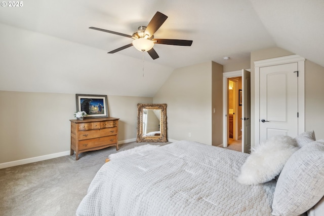bedroom with baseboards, light colored carpet, a ceiling fan, and lofted ceiling