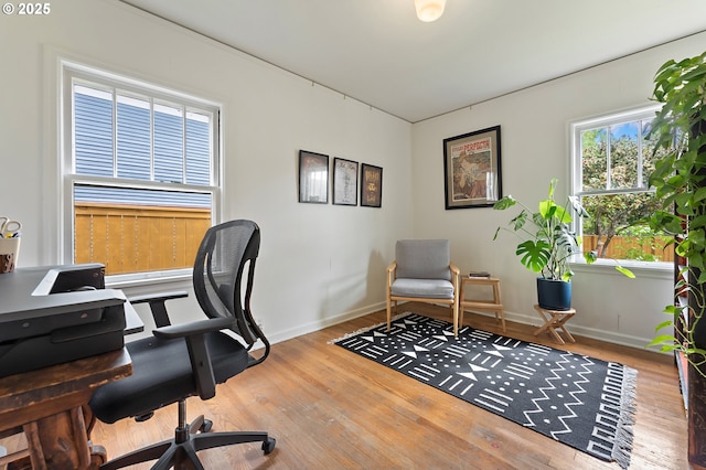 office featuring baseboards and wood finished floors