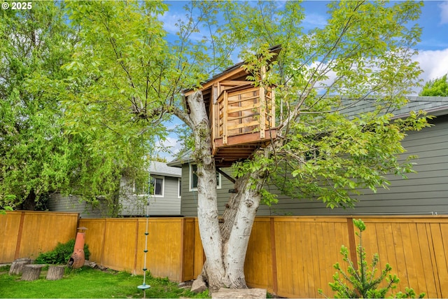 back of house featuring fence