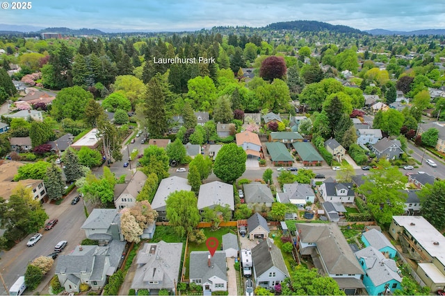 drone / aerial view with a residential view and a mountain view