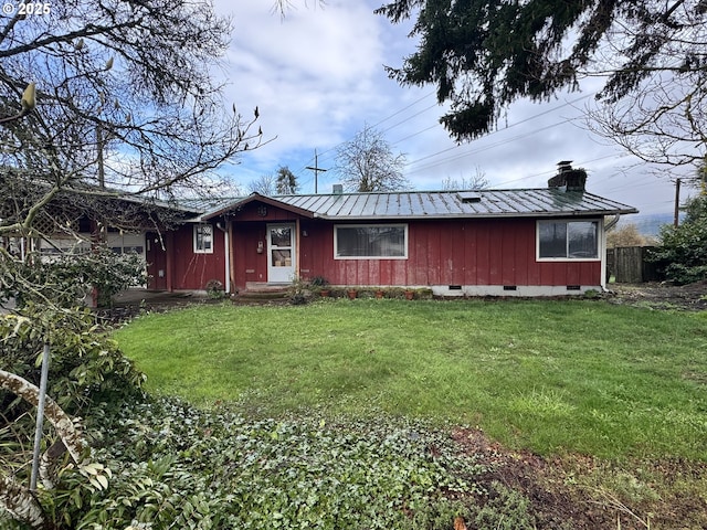 ranch-style house with a front lawn, metal roof, a chimney, and crawl space