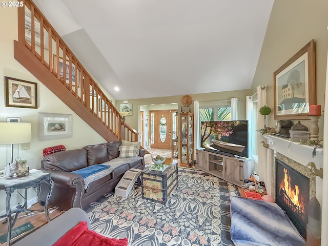 6931 Oakwood Ct, Brookings, OR 97415 - living room with stairs, a fireplace, and lofted ceiling