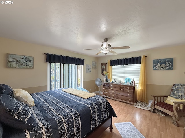 6931 Oakwood Ct, Brookings, OR 97415 - bedroom with light wood-style flooring and a ceiling fan