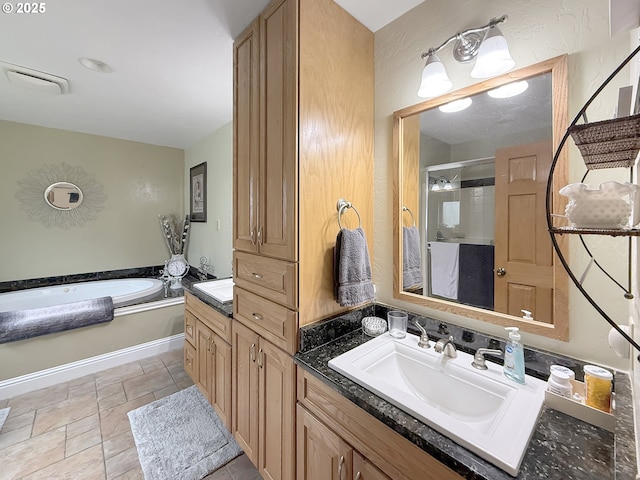 6931 Oakwood Ct, Brookings, OR 97415 - bathroom featuring a shower stall, a bath, and vanity