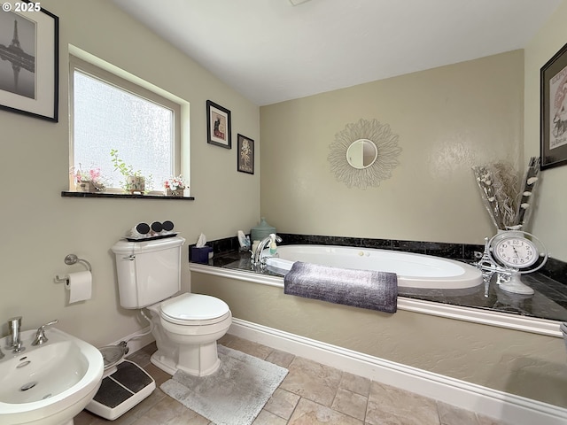 6931 Oakwood Ct, Brookings, OR 97415 - bathroom with toilet, a bidet, and a garden tub