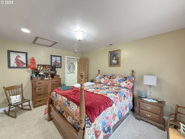 6931 Oakwood Ct, Brookings, OR 97415 - bedroom featuring light carpet, attic access, baseboards, and visible vents