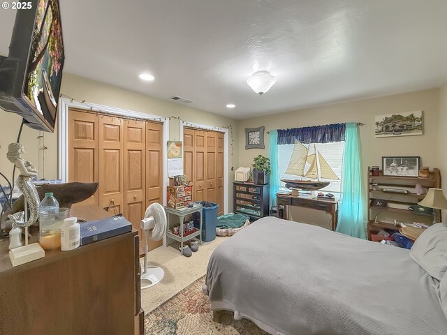 6931 Oakwood Ct, Brookings, OR 97415 - carpeted bedroom with recessed lighting, visible vents, and two closets