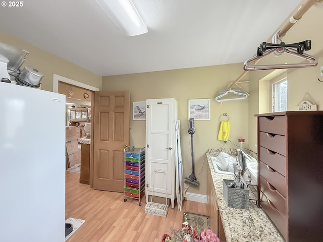 6931 Oakwood Ct, Brookings, OR 97415 - interior space featuring light wood-type flooring and freestanding refrigerator
