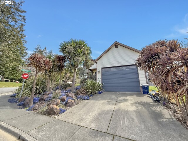 6931 Oakwood Ct, Brookings, OR 97415 - view of front of property with an outbuilding, a garage, and concrete driveway