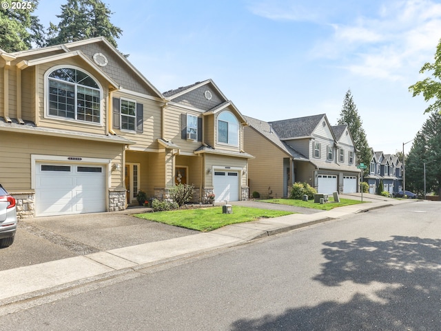 15235 SW Jasper Ln, Beaverton, OR 97007 - townhome / multi-family property with a garage, a residential view, driveway, and stone siding