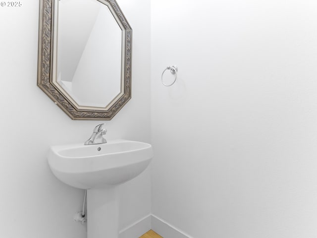 15235 SW Jasper Ln, Beaverton, OR 97007 - bathroom featuring baseboards and a sink