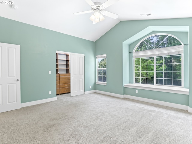 15235 SW Jasper Ln, Beaverton, OR 97007 - unfurnished bedroom with carpet floors, lofted ceiling, multiple windows, a closet, and a ceiling fan