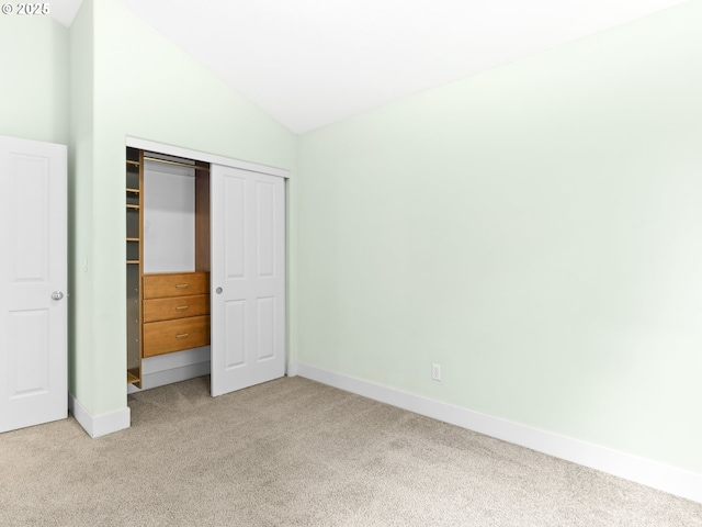15235 SW Jasper Ln, Beaverton, OR 97007 - unfurnished bedroom with light colored carpet, lofted ceiling, and a closet