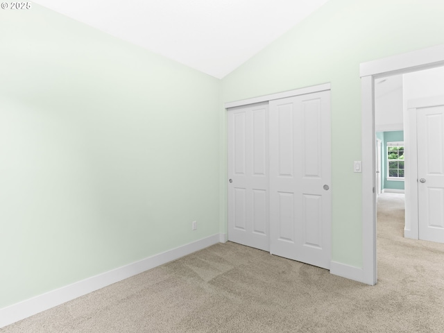 15235 SW Jasper Ln, Beaverton, OR 97007 - unfurnished bedroom with carpet flooring, vaulted ceiling, and a closet
