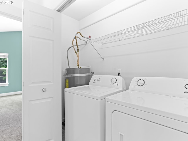 15235 SW Jasper Ln, Beaverton, OR 97007 - laundry area with washing machine and dryer, carpet, and secured water heater