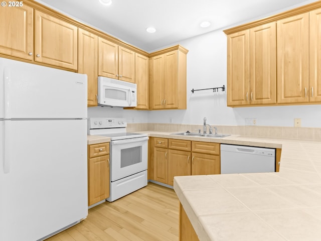 15235 SW Jasper Ln, Beaverton, OR 97007 - kitchen with white appliances, tile counters, light wood finished floors, recessed lighting, and light brown cabinetry