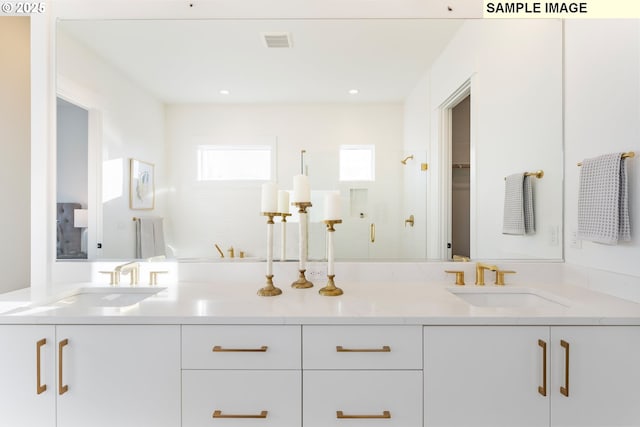 bathroom with connected bathroom, plenty of natural light, and a freestanding bath