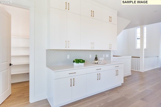 dining area with baseboards, a large fireplace, healthy amount of natural light, a high ceiling, and recessed lighting