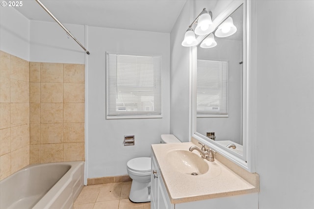 4912 N Yale St, Portland, OR 97203 - full bath with tile patterned floors, toilet, vanity, tub / shower combination, and baseboards