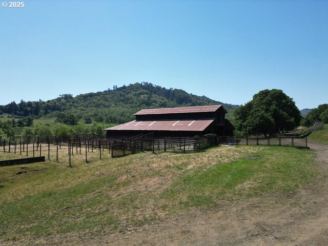 1104 Rio Nes Ln, Roseburg, OR 97470 - view of outdoor structure featuring an exterior structure and a view of rural / pastoral area