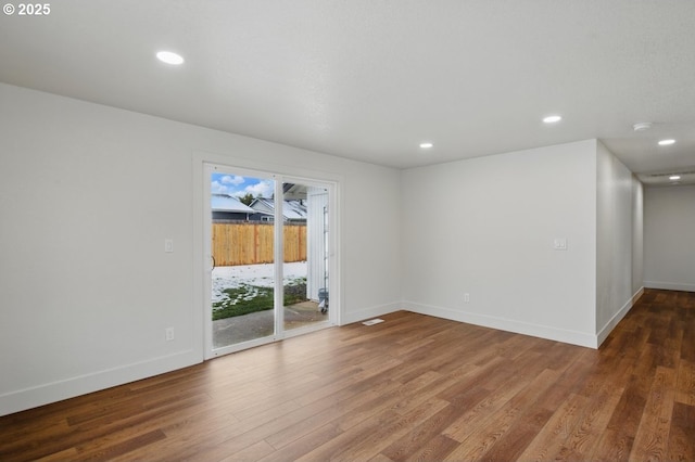 empty room featuring hardwood / wood-style floors