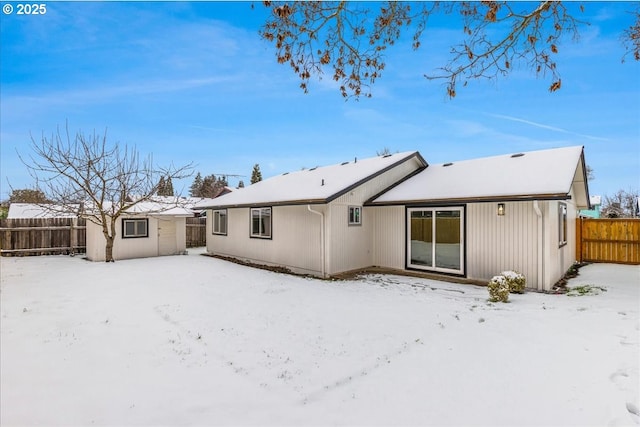 view of snow covered house