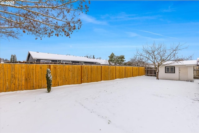 view of yard layered in snow