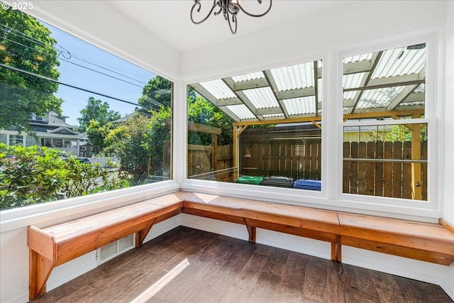 3315 SE 15th Ave, Portland, OR 97202 - unfurnished sunroom featuring a chandelier and wood finished floors