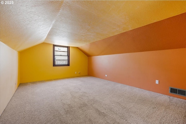 3315 SE 15th Ave, Portland, OR 97202 - additional living space featuring carpet floors, vaulted ceiling, and a textured ceiling