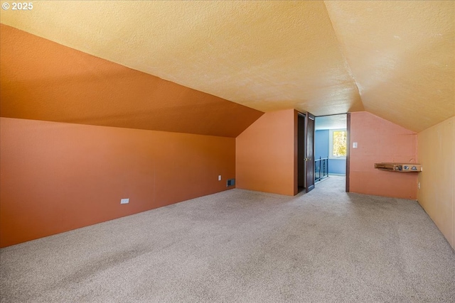 3315 SE 15th Ave, Portland, OR 97202 - additional living space with carpet, lofted ceiling, and a textured ceiling