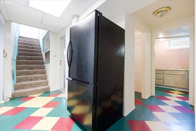 3315 SE 15th Ave, Portland, OR 97202 - kitchen featuring freestanding refrigerator, tile patterned floors, and baseboards