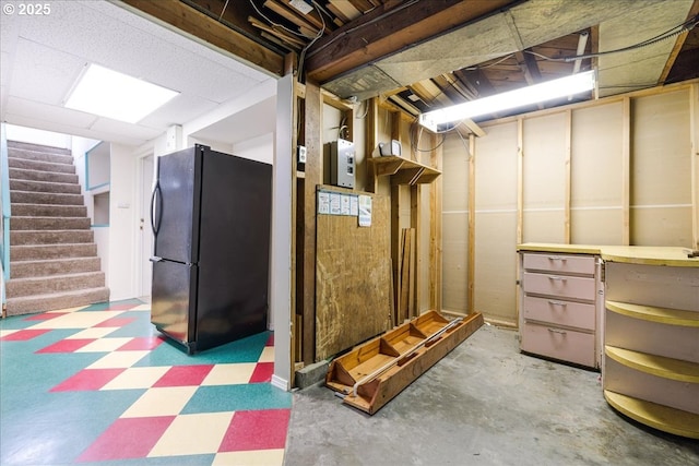 3315 SE 15th Ave, Portland, OR 97202 - unfinished basement featuring freestanding refrigerator, stairway, and tile patterned floors