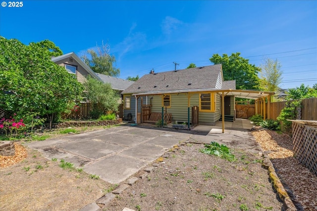3315 SE 15th Ave, Portland, OR 97202 - back of property featuring a fenced backyard, a patio, and roof with shingles
