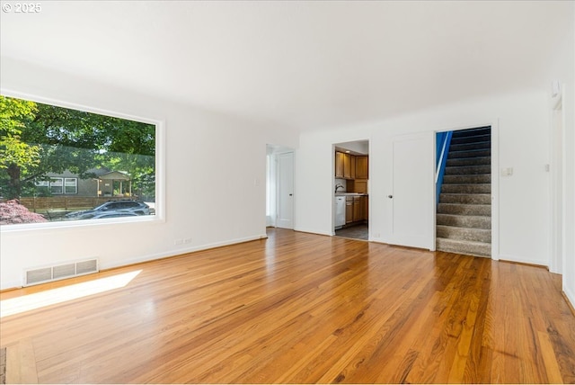 3315 SE 15th Ave, Portland, OR 97202 - empty room with stairway, wood finished floors, and baseboards