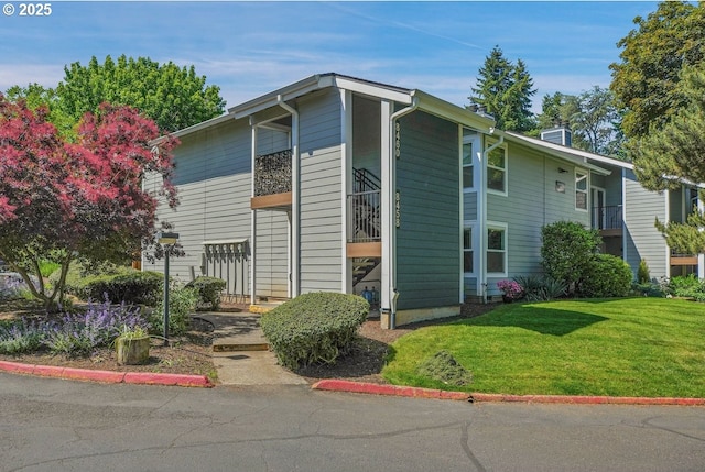 8458 SW Mohawk St, Tualatin, OR 97062 - view of front of property featuring a front yard and a chimney