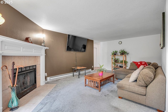 8458 SW Mohawk St, Tualatin, OR 97062 - living room featuring a fireplace, a baseboard heating unit, light colored carpet, and a textured ceiling