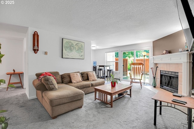 8458 SW Mohawk St, Tualatin, OR 97062 - living room with carpet floors, a fireplace, and a textured ceiling