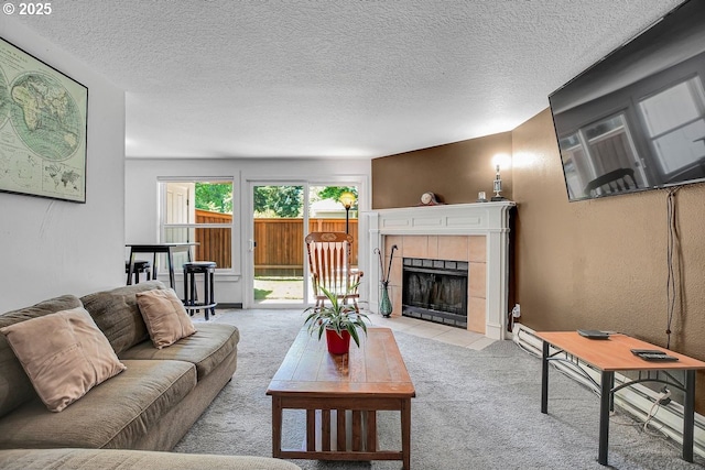 8458 SW Mohawk St, Tualatin, OR 97062 - living room with light colored carpet, a fireplace, and a textured ceiling