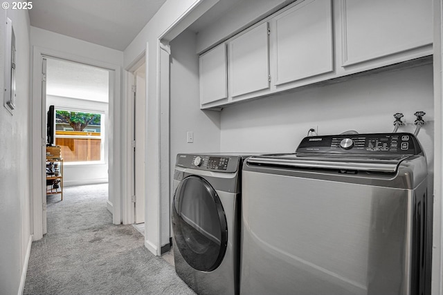 8458 SW Mohawk St, Tualatin, OR 97062 - laundry room with cabinet space, light colored carpet, washing machine and clothes dryer, and baseboards