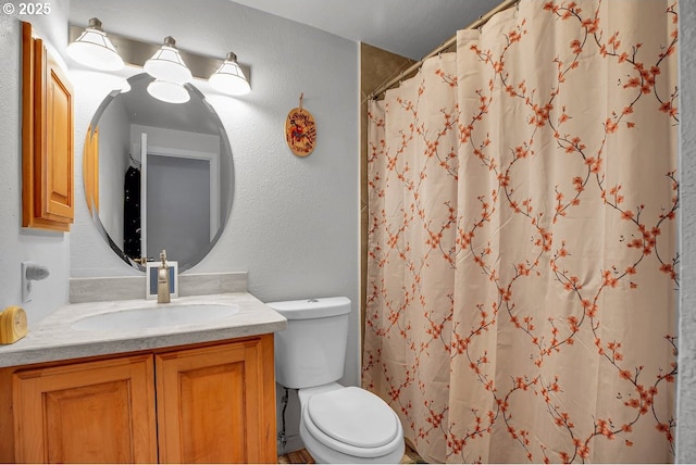 8458 SW Mohawk St, Tualatin, OR 97062 - bathroom featuring toilet, vanity, and curtained shower