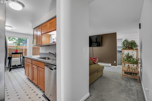 8458 SW Mohawk St, Tualatin, OR 97062 - kitchen with appliances with stainless steel finishes, a sink, a baseboard radiator, and baseboards