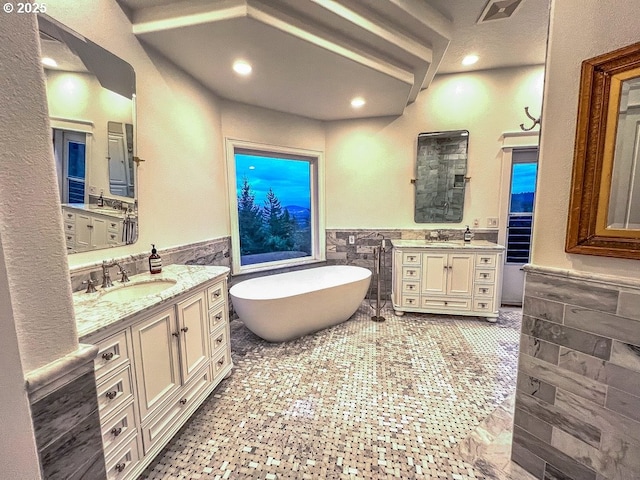 1500 SW Miller Ct, Gresham, OR 97080 - bathroom with tile walls, a wainscoted wall, two vanities, a soaking tub, and recessed lighting