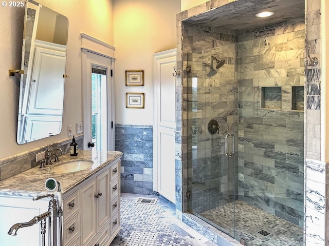 1500 SW Miller Ct, Gresham, OR 97080 - bathroom featuring a shower stall, vanity, a wainscoted wall, and tile walls