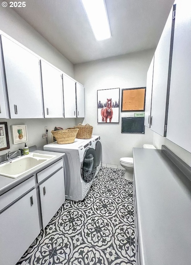 1500 SW Miller Ct, Gresham, OR 97080 - laundry room with washing machine and clothes dryer, cabinet space, and light tile patterned floors