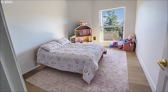 1500 SW Miller Ct, Gresham, OR 97080 - bedroom with baseboards and wood finished floors