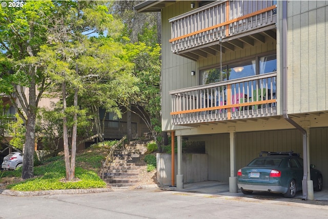 7522 SW Barnes Rd Unit E, Portland, OR 97225 - view of property with stairway and covered parking