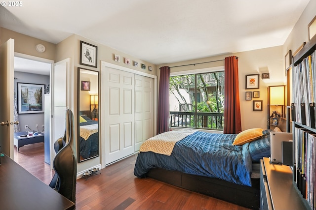 7522 SW Barnes Rd Unit E, Portland, OR 97225 - bedroom with wood finished floors, a closet, a desk, and access to exterior